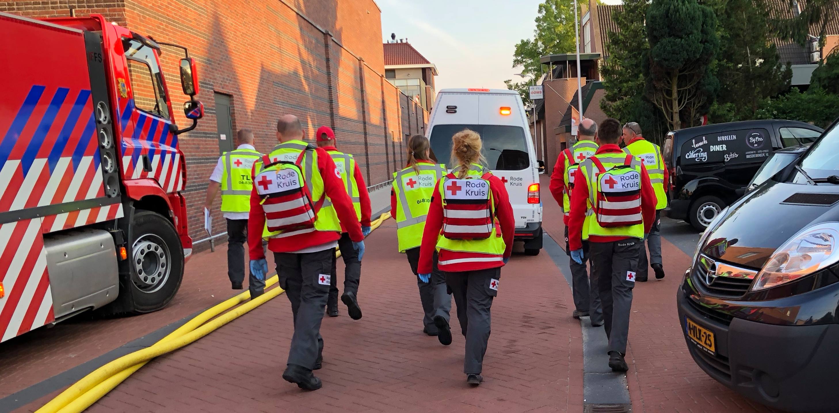 A team from NHT IJsselland, showing 8 Red Cross members walking away from the camera towards their van. Image taken from NHT IJsselland Facebook profile